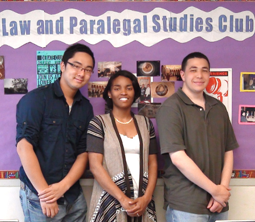 Three student in a photo represesting the Law and Paralegal studies club