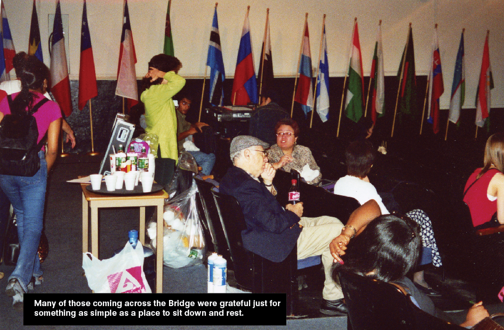 People sitting and resting in a room with some cups and drinks on a table