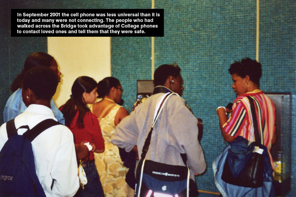 People standing on a line to use the telephone to contact their loved ones