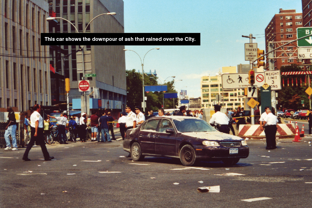 A car covered with ash from the aftermath of 9/11 on the street